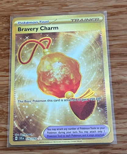Bravery Charm - 175/142 - Gold Secret Rare - NM/M - Pokemon TCG - Stellar Crown